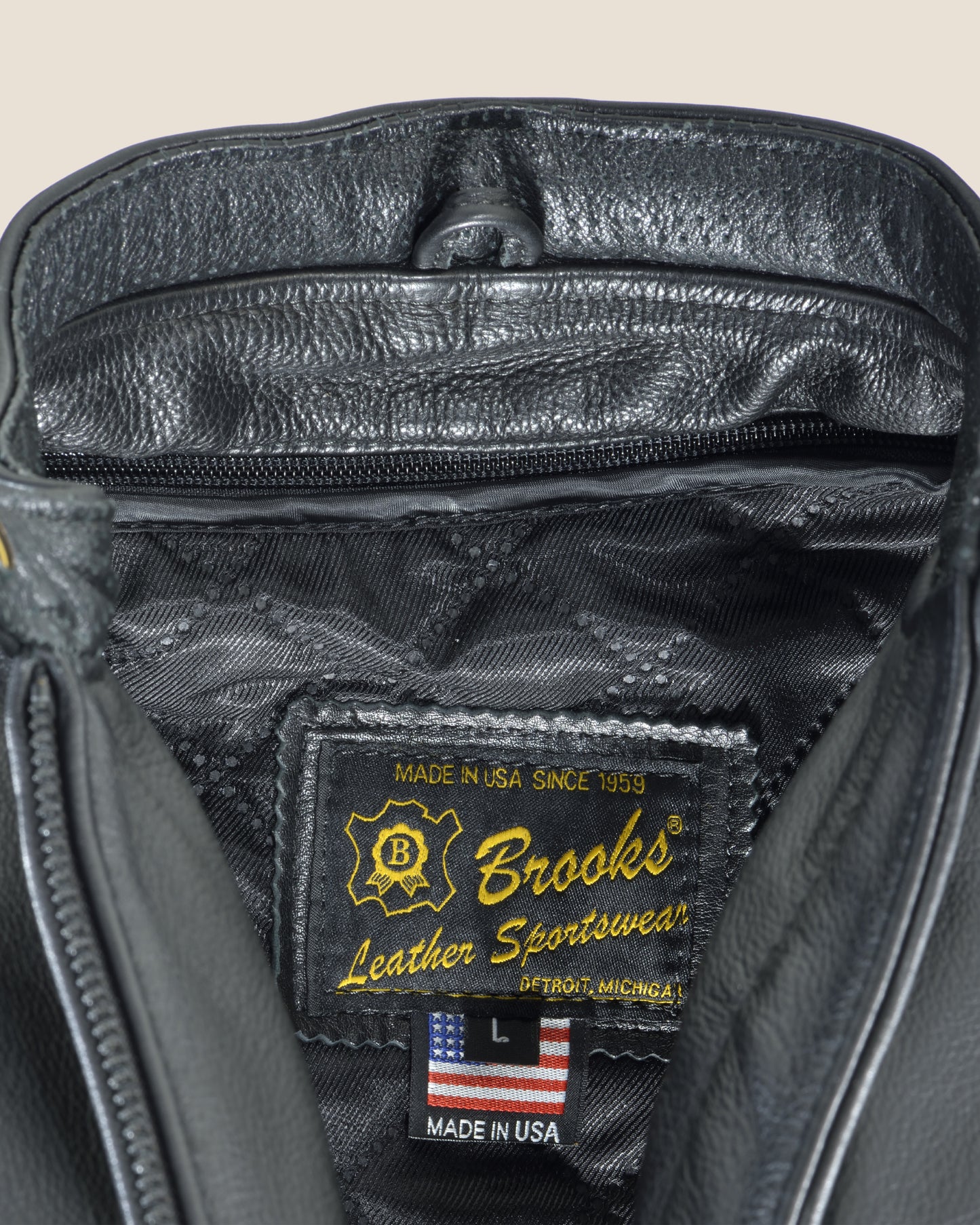 Brooks women’s jacket with detailed stitching and label